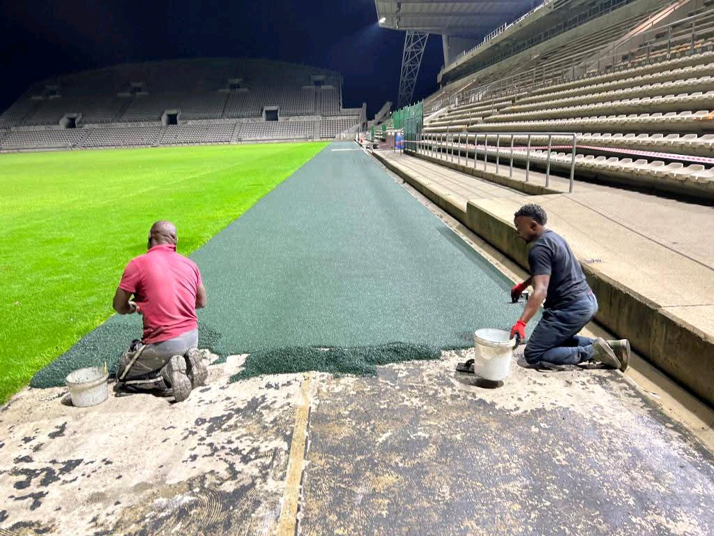 Rubber flooring installation at a stadium walkway